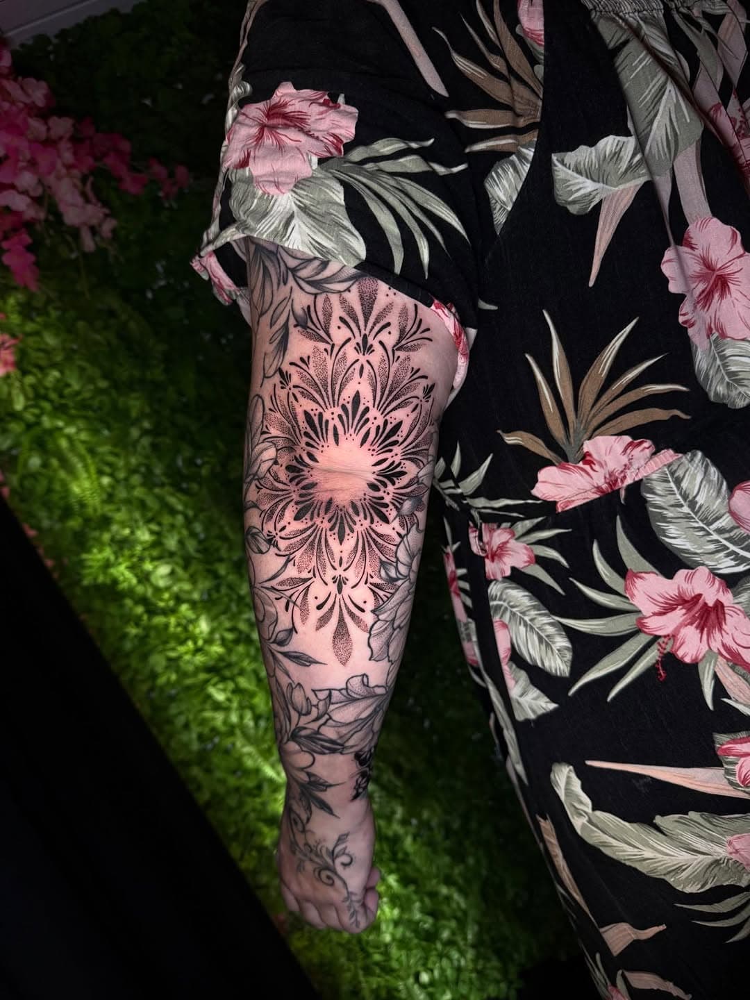 Intricate black-and-grey leg sleeve tattoo featuring ornate mandala centerpiece with flowing botanical patterns extending down to foot