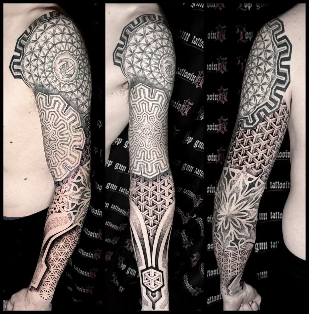 Intricate geometric blackwork full sleeve tattoo featuring sacred geometry patterns, mandalas, flower of life, and dotwork shading in black and grey